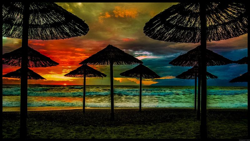 sunset beach umbrellas corfu